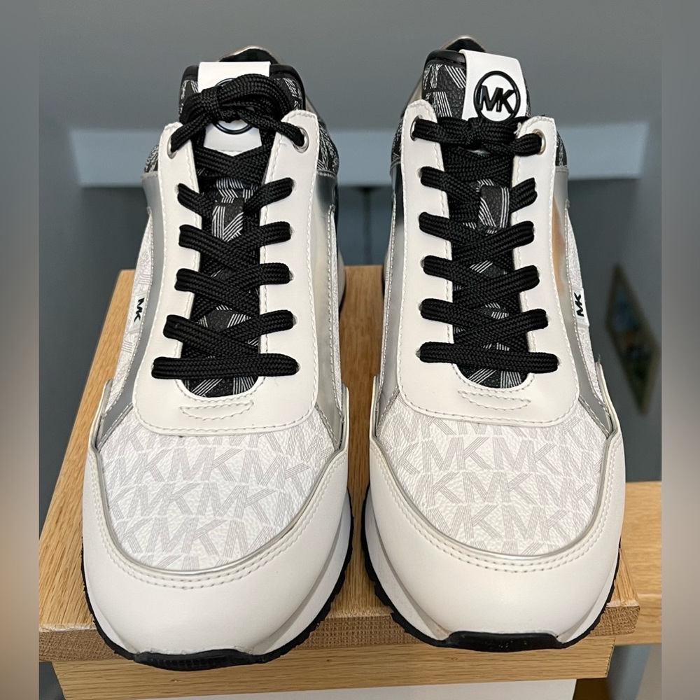 Michael Kors black, white, and chrome sneakers.